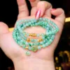 Chuỗi hoa bay xanh táo mix charm vàng