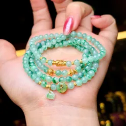 Chuỗi hoa bay xanh táo mix charm vàng