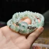 Chuỗi phỉ thuý hoa bay băng khởi mix charm vàng